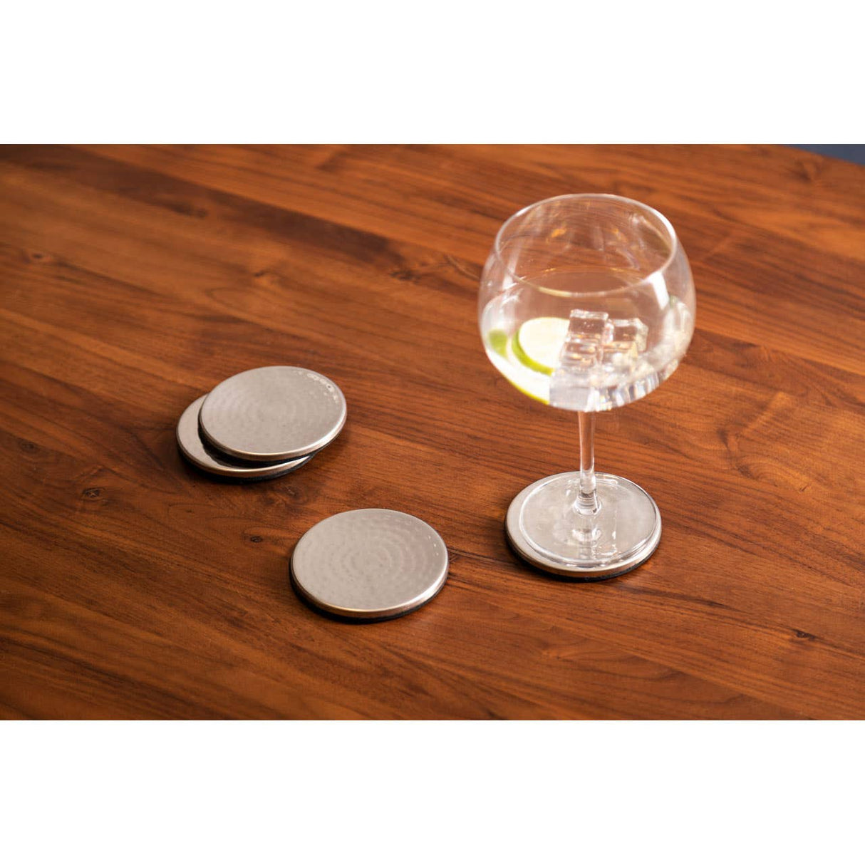 Set Of Four Hammered Effect Stainless Steel Coasters