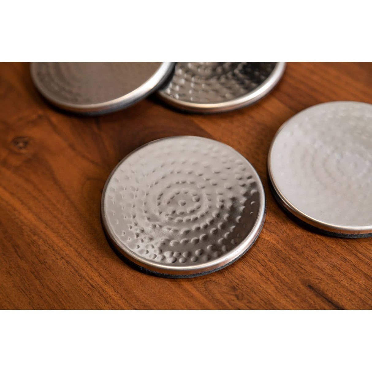 Set Of Four Hammered Effect Stainless Steel Coasters