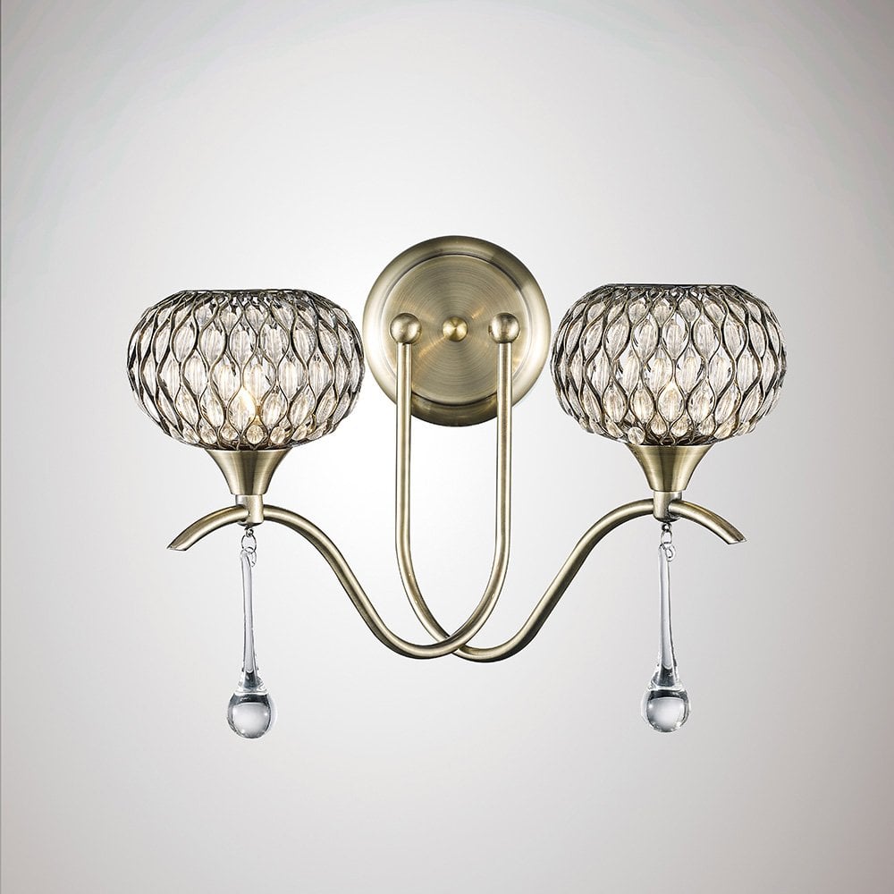 Chelsie Dual Light Wall Sconce in Antique Brass with Clear Glass Shades