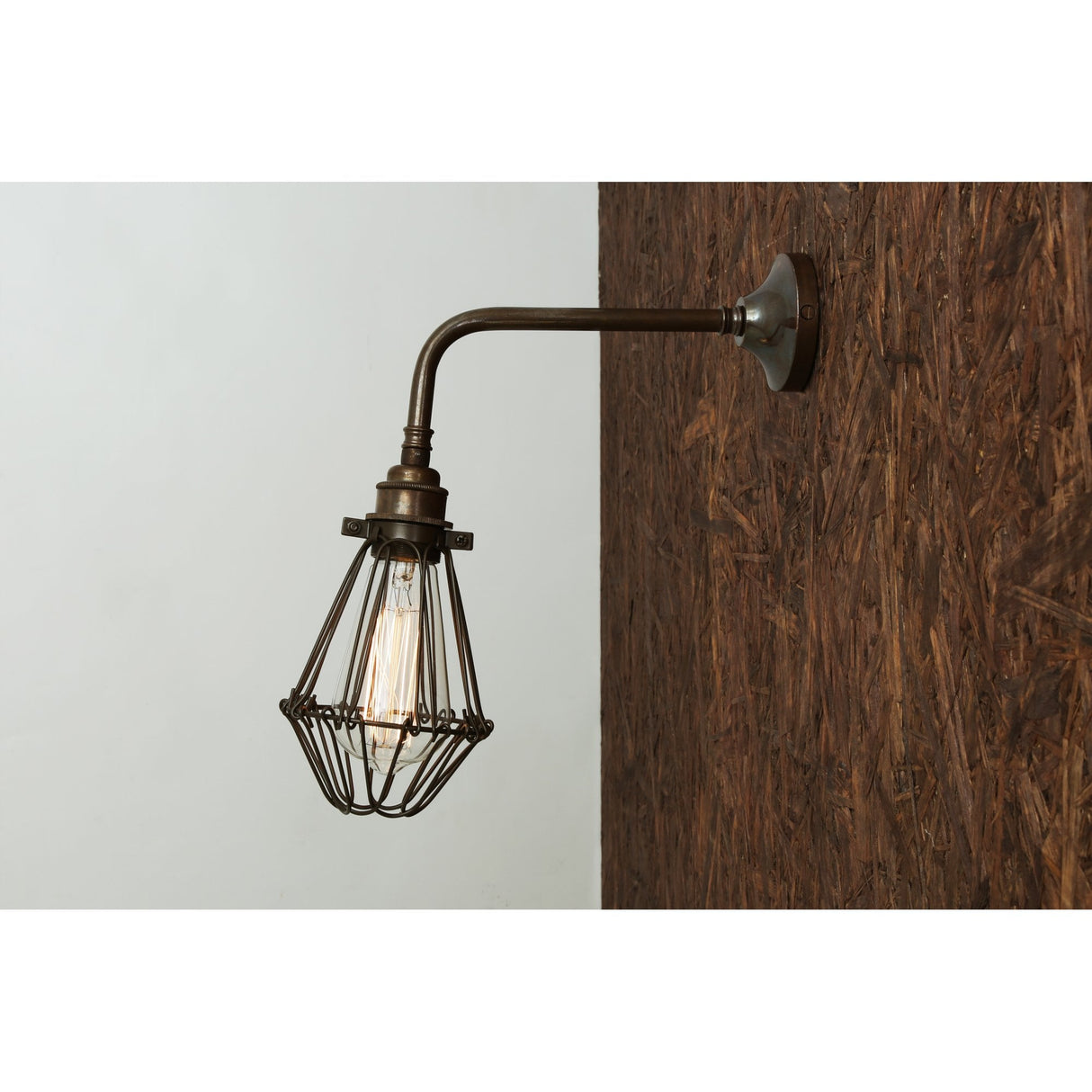 Vintage Industrial Wall Light with Brass Cage Design