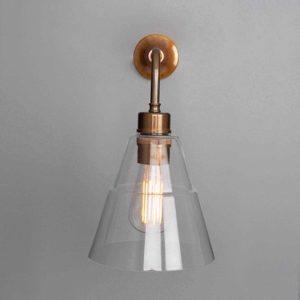 Lyx Antique Brass Wall Sconce with Clear Cone Glass Shade