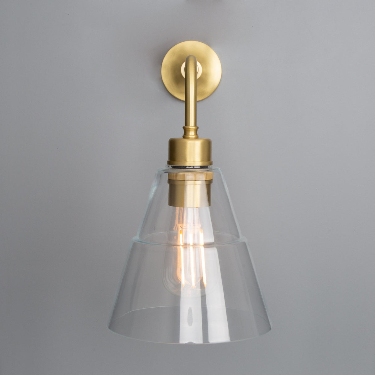Lyx Antique Brass Wall Sconce with Clear Cone Glass Shade