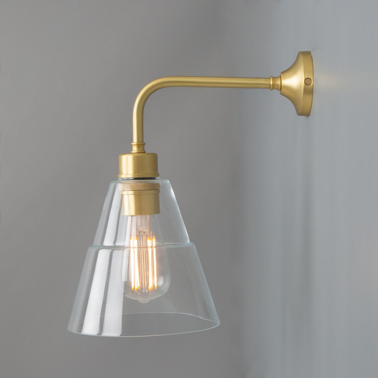 Lyx Antique Brass Wall Sconce with Clear Cone Glass Shade