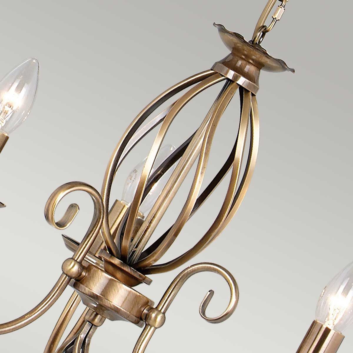 Elegant Artisan 3-Light Brass Chandelier with Ornate Scroll Design