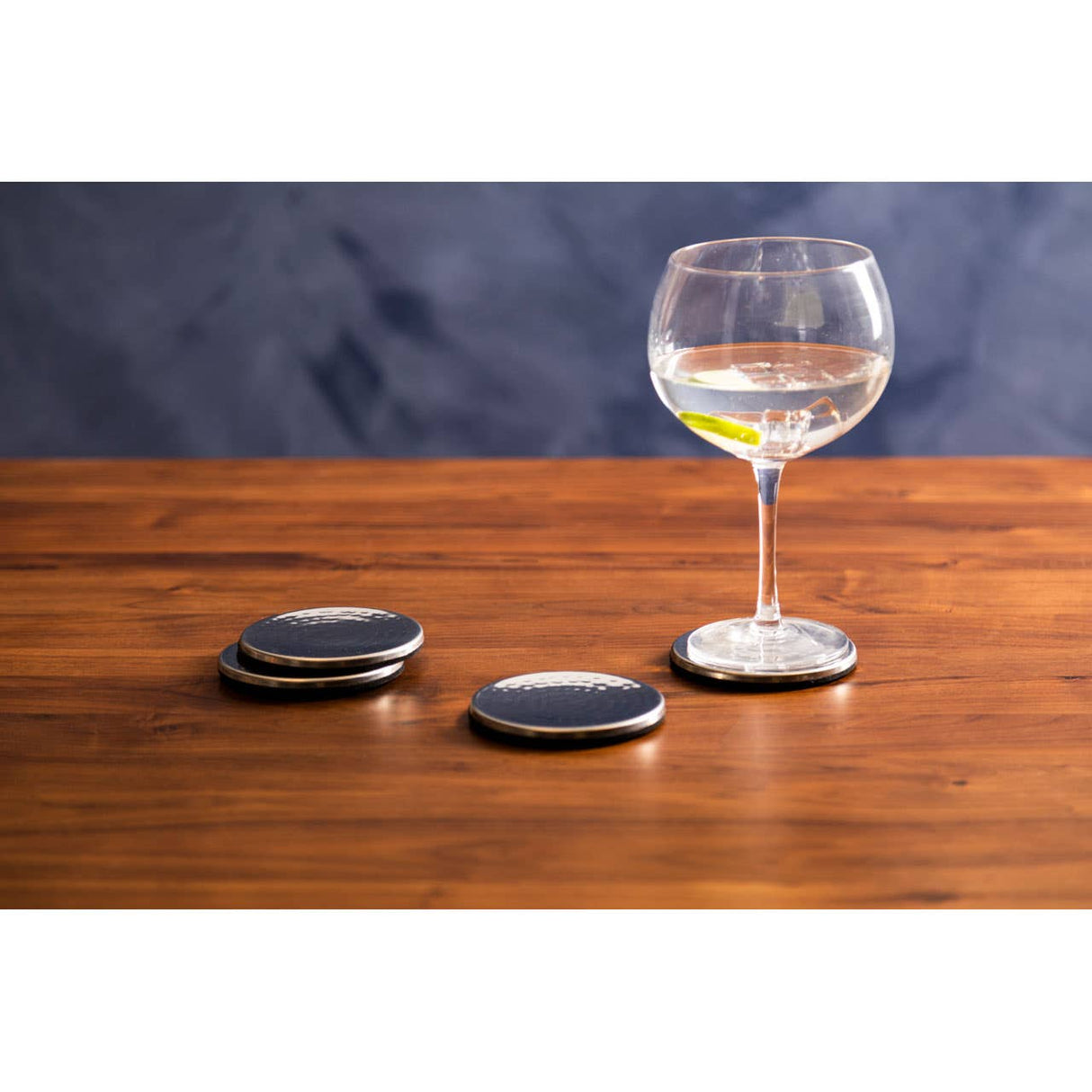 Set Of Four Hammered Effect Stainless Steel Coasters