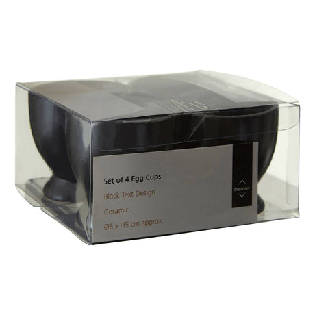 Set Of Four Black Text Egg Cups