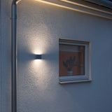 Sleek Chieri White LED Outdoor Wall Light with Warm Wash Effect