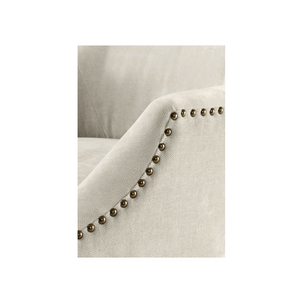 Legacy Dining Chair: Clarck Sand Upholstery with Antique Brass Accents and Black Legs