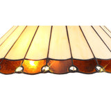 Elegant Octagonal Tiffany Floor Lamp with Amber and Cream Shade in Antique Brass Finish