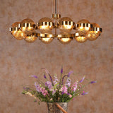 Ophira 12 Light Pendant Antique Gold and Amber Ribbed Glass