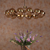 Ophira 12 Light Pendant Antique Gold and Amber Ribbed Glass