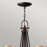 Elegant Bronze Mayflower 9-Light Chandelier with Amber Glass
